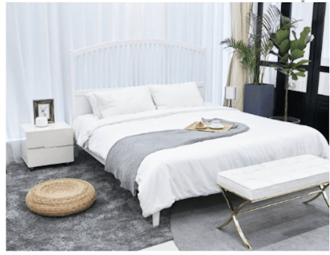 Bright modern bedroom with neutral palette, natural light and refined furnishings